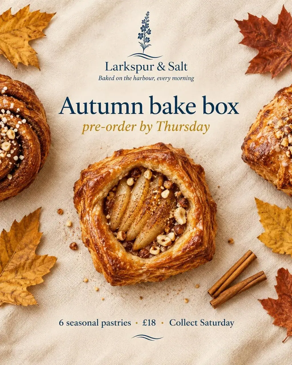 An overhead flat lay of a pear danish on linen with cinnamon sticks and leaves under the bake box headline